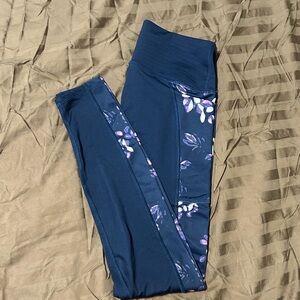 Under armor leggings. Navy blue with pink, purple, and white floral print.